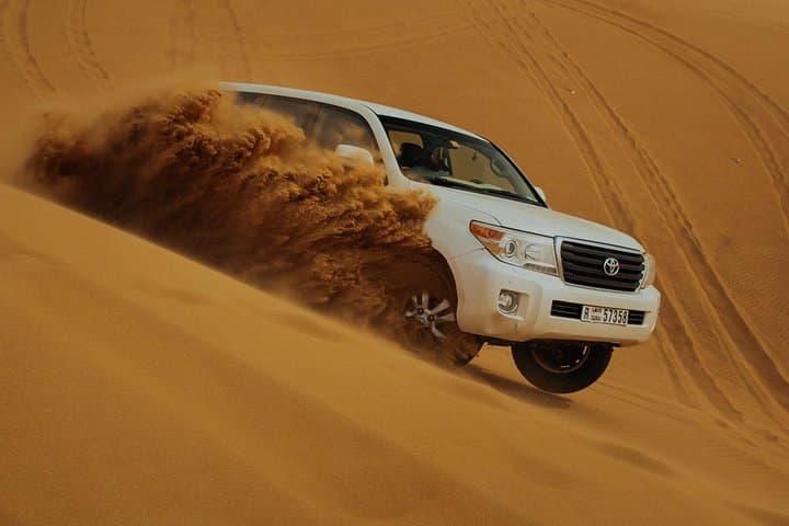 Evening Desert Safari Dubai: Dune Bashing, Sunset & BBQ Experience