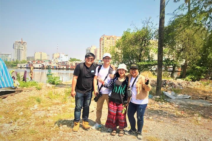 Scooter Through Saigon's Contrasts: Slum & Chillspots Tour with a Female Driver