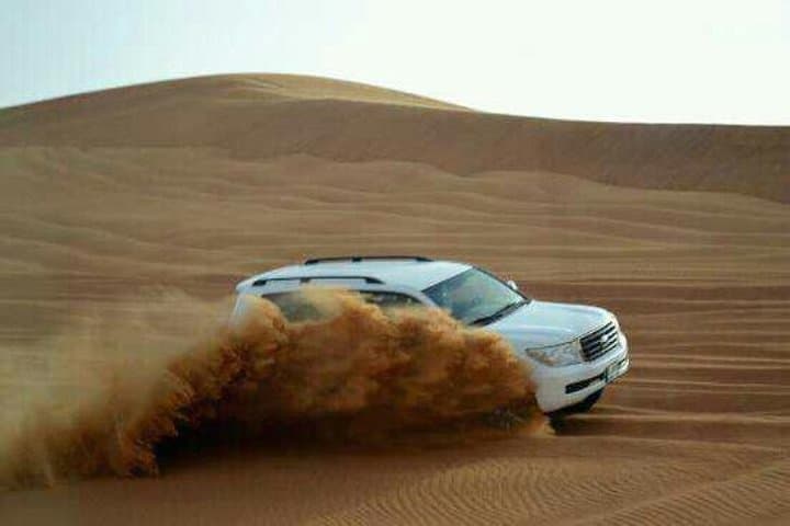 Dubai Desert Safari: Sunset Dune Bashing, BBQ Dinner & Camel Ride