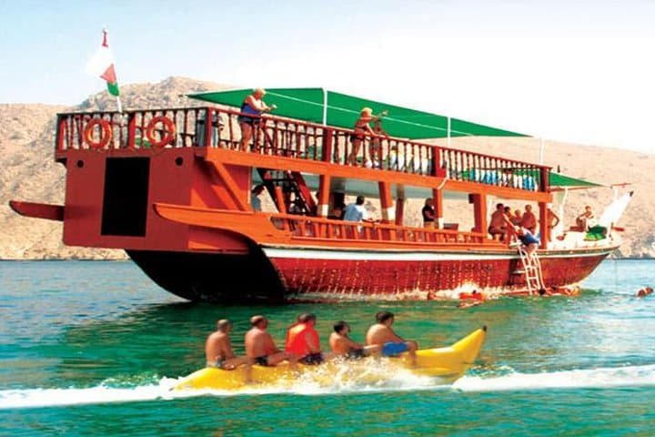Dibba Musandam Dhow Cruise from Dubai — Fjords, Dolphins & Snorkeling photo 1