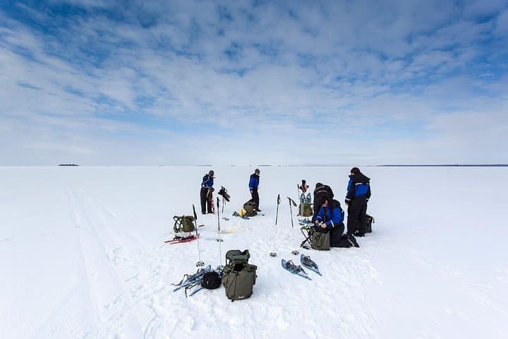 Snowmobile Ice Fishing from Levi: Campfire Catch & Arctic Silence photo 5
