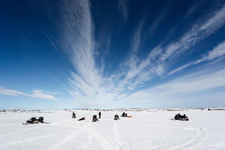 Snowmobile Ice Fishing from Levi: Campfire Catch & Arctic Silence photo 6
