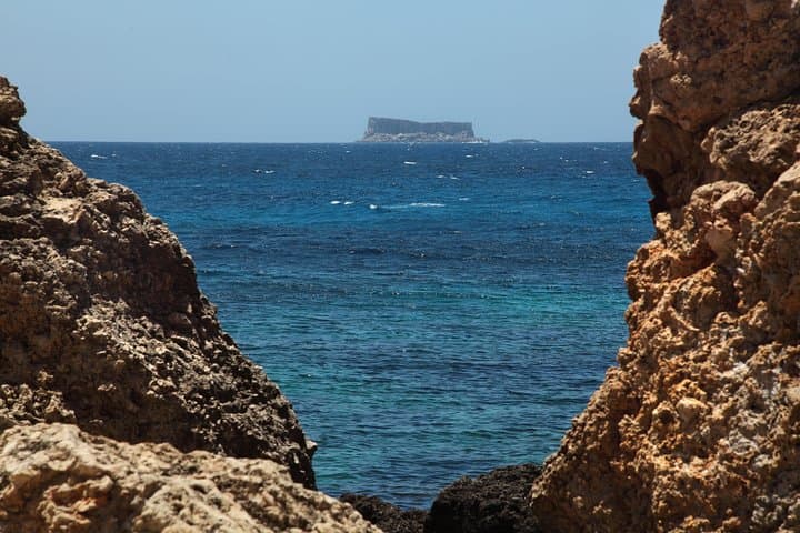 Explore Blue Grotto & Marsaxlokk: Half-Day Market, Cliffs and Boat Views from Valletta photo 4