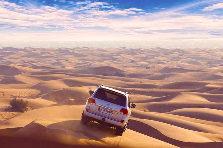 Sunset 4x4 Desert Safari in Dubai: Dune Bashing, BBQ & Live Shows