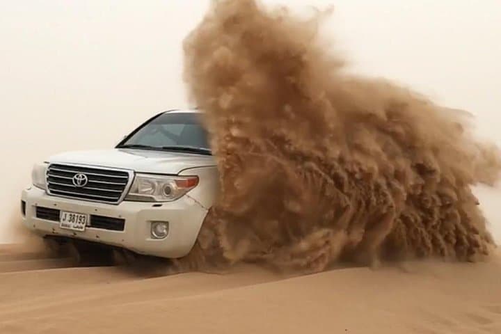 Lahbab Desert Dune Ride: Sandboarding, Dune Bashing & Camel Photos from Dubai