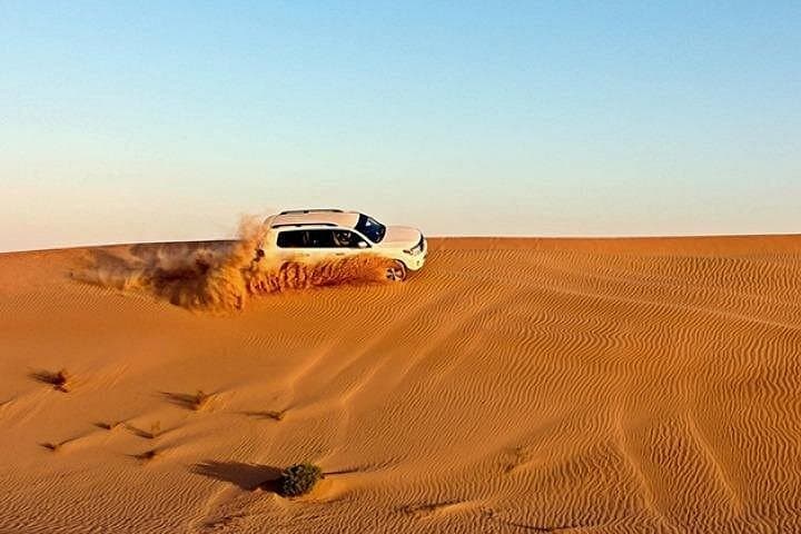 Sunset Desert Safari in Dubai: Dune Bashing, Camel Rides & Arabic BBQ Under the Stars photo 3