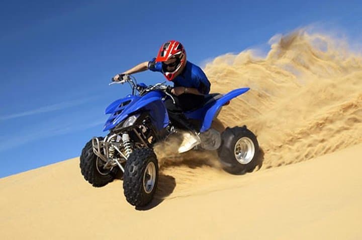 Evening Desert Safari in Dubai: Dune Bashing, Camel Ride & Sandboarding at Sunset