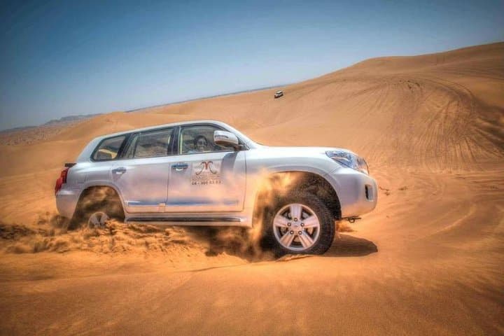 Dubai Red Dune Desert Safari — 4-Hour Dune Bashing, Camel Ride & BBQ Experience