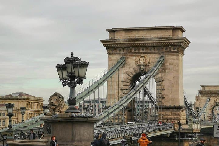 Iconic Chain Bridge over Danube with pedestrians and historic details