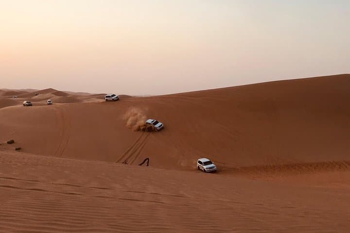 Evening Abu Dhabi Desert Safari: Dune Bashing, Sandboarding & BBQ Under the Stars