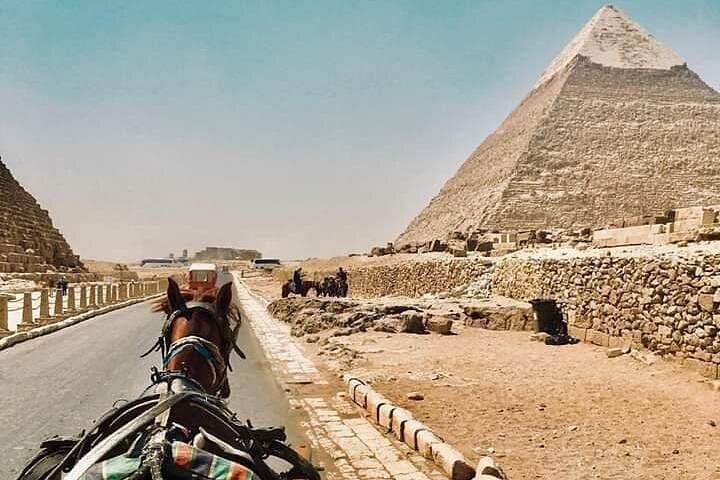 Sunset Camel Ride Around the Pyramids of Giza — Guided Tour & Evening Experience photo 3