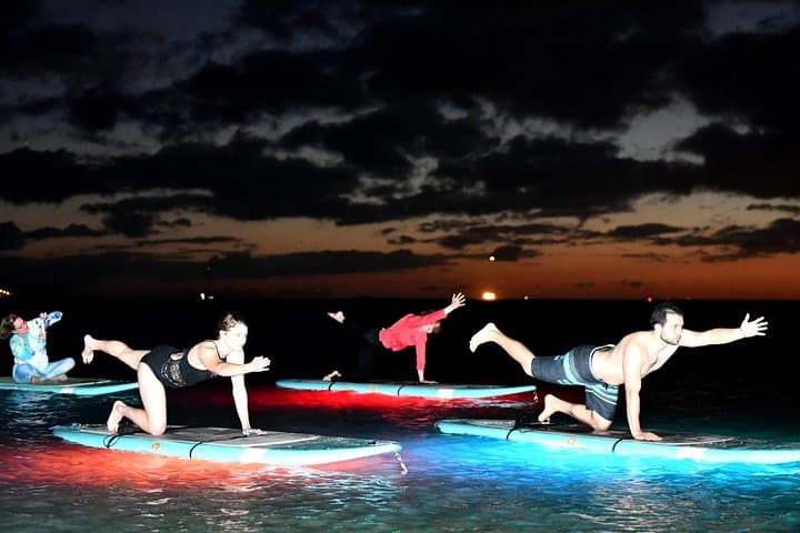 Night SUP Yoga in Honolulu: Paddle, Glow, and Flow on Magic Island photo 4