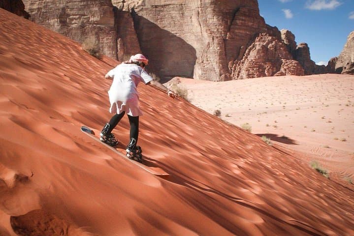 Half-Day Wadi Rum Jeep and Camel Tour with Sandboarding