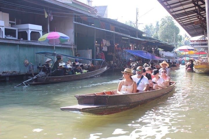 From Train Tracks to Emerald Pools: Damnoen Floating Market & Erawan Falls Day Tour photo 3