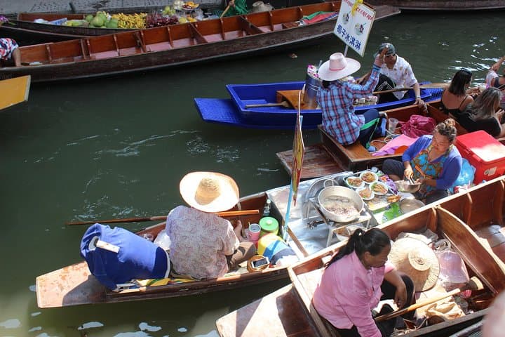 From Train Tracks to Emerald Pools: Damnoen Floating Market & Erawan Falls Day Tour photo 5