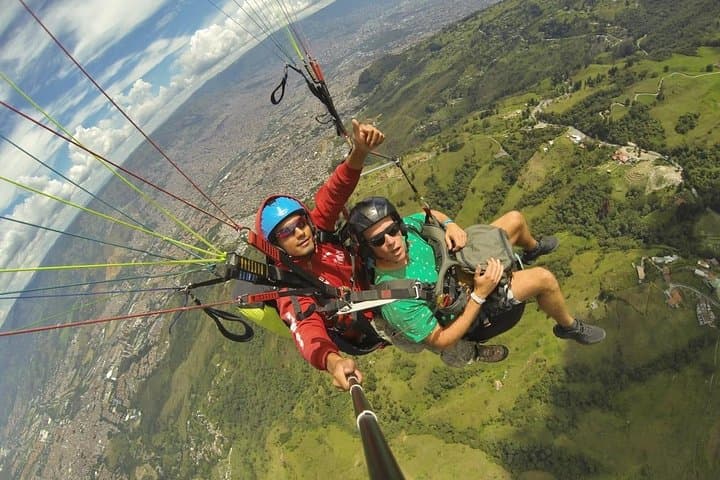 Tandem Paragliding Over Medellín: Half-Day Flight with Transport & HD GoPro