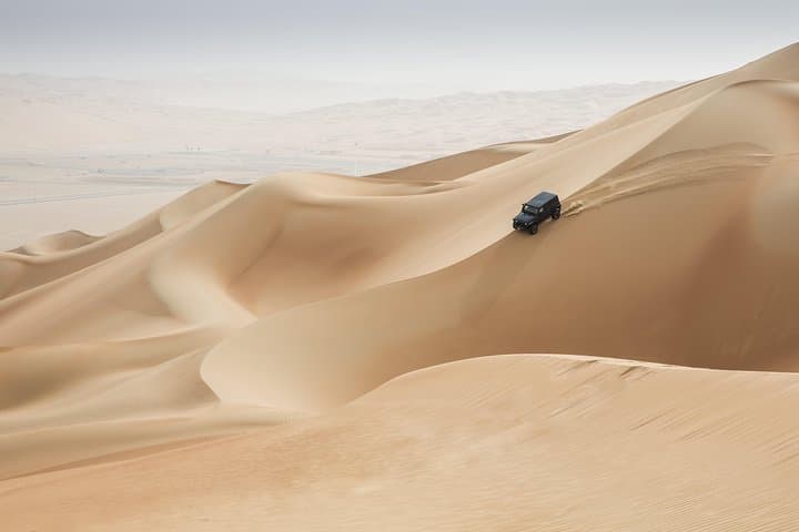 Evening Desert Safari in Abu Dhabi: Dune Bashing, Camel Rides & Bedouin Camp Experience
