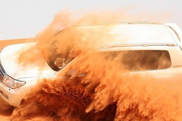Red Dunes Morning Safari in Dubai — Dune Bashing, Sandboarding & Camel Ride