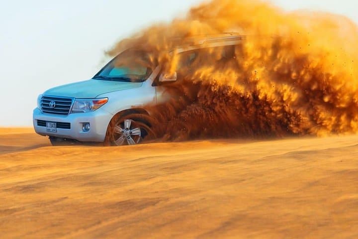 Morning Camel Trekking with Dune Bashing & Sand Boarding in Dubai Desert photo 2