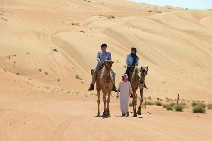 Morning Camel Trekking with Dune Bashing & Sand Boarding in Dubai Desert photo 4