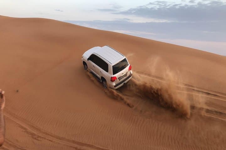 Evening Dubai Desert Safari: Dune Bashing, Camel Rides & BBQ Under the Stars photo 2