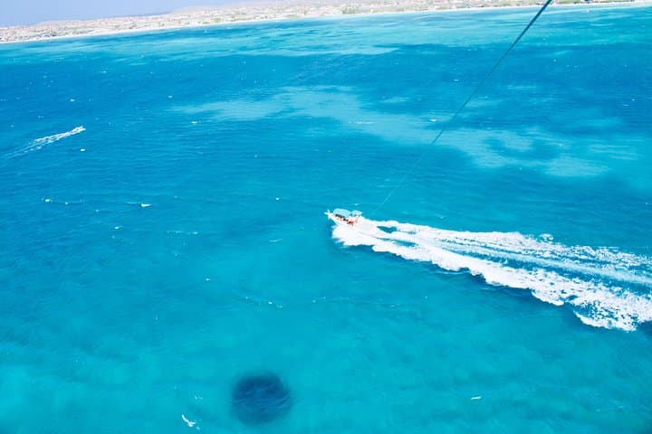 Soar Above Palm Beach: Parasailing Over Aruba's Turquoise Coast photo 6