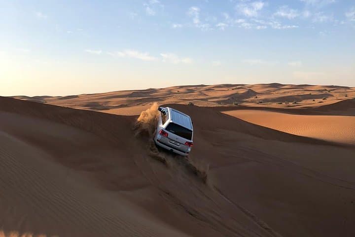 Evening Dubai Desert Safari: Dune Bashing, Camel Rides & BBQ Under the Stars
