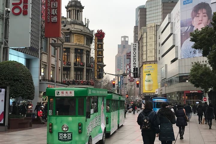 Private Shanghai Layover Tour: Jade Buddha, Silk Museum & Sunset at Oriental Pearl Tower photo 4