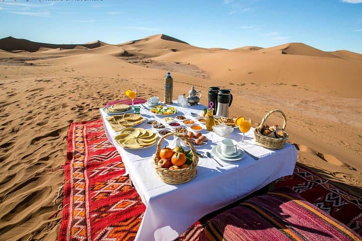 Overnight in Erg Lihoudi: Luxury Desert Camp, Camel Ride & Sandboarding near M’Hamid photo 1