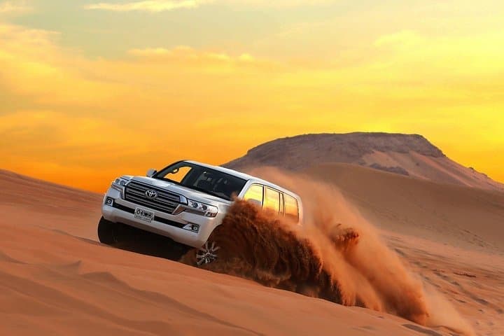 Dune Bash and Belly Dance: Dubai Desert Safari with Camel Ride & BBQ