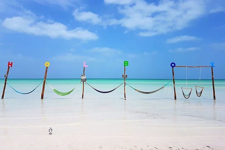 Holbox Day Trip from Cancun: Boat to Cenotes, Passion Island & Beach Bikes photo 4