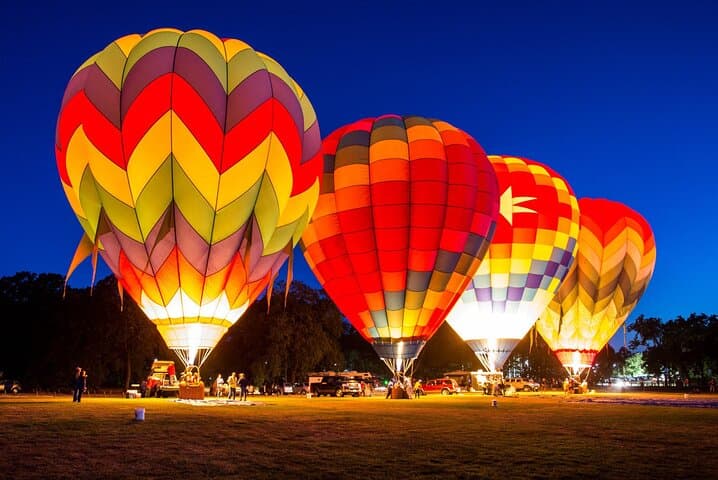 Sunrise Hot-Air Balloon Over Dubai Desert — Falcon Show, Breakfast & Transfer