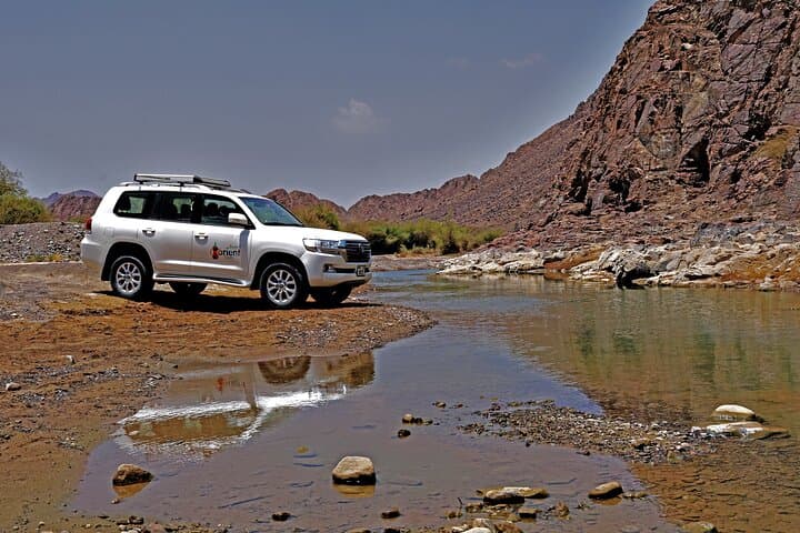 Wadi Shawka Private 4x4 Desert Drive: Dune Bashing, Sandboarding & Natural Pools photo 3