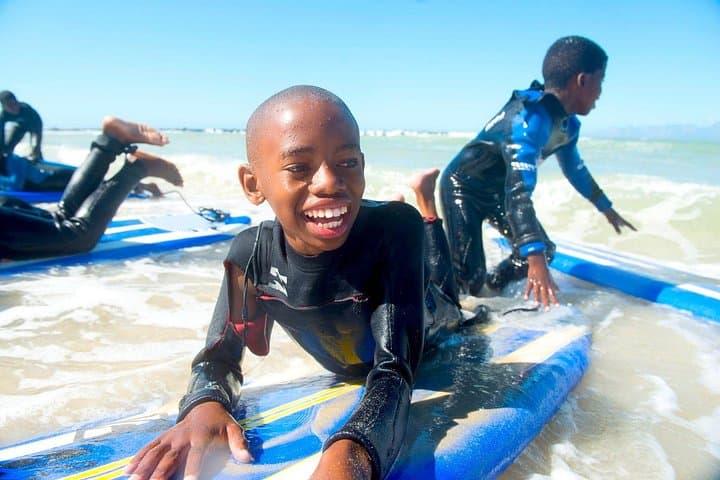 Cape Town Surf Lesson with NGO Kids: Learn to Surf and Support Local Changemakers