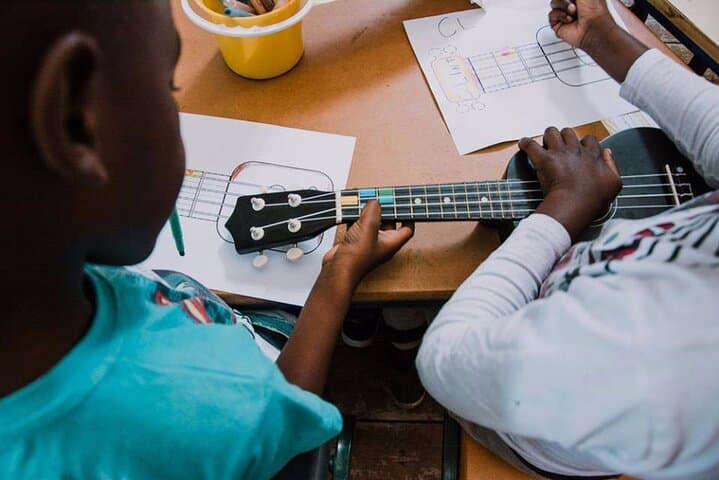 Cape Town Music Lesson with NGO Kids: Ukulele & Djembe Workshop photo 2