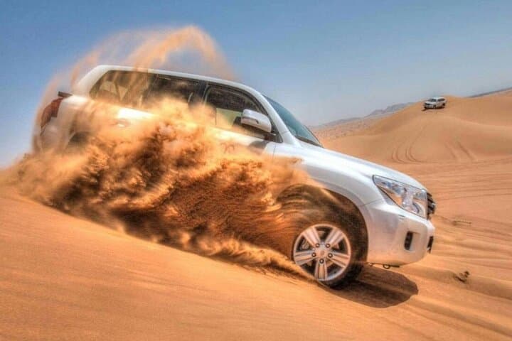 Dubai Desert Safari: Dune Bashing, Camel Rides, Sandboarding & BBQ Under the Stars