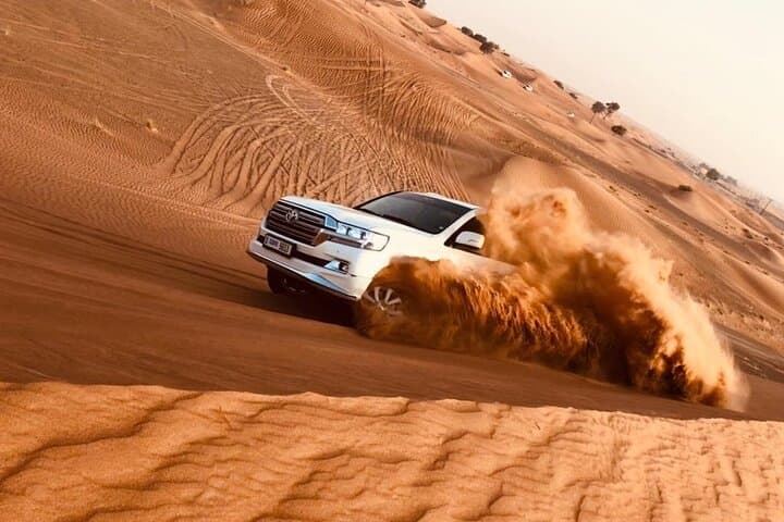 Evening Red Dune Safari in Dubai: Dune Bashing, Camel Ride & Live Desert Show photo 2