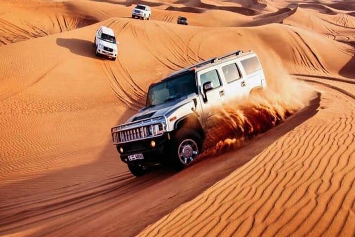 Dubai Evening Desert Safari: Dune Bashing, Camel Rides & BBQ at Sunset