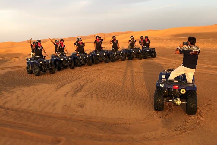 Dubai Red Dunes Quad Bike Adventure: Self-Drive ATV, Sandboarding & Camel Ride photo 1