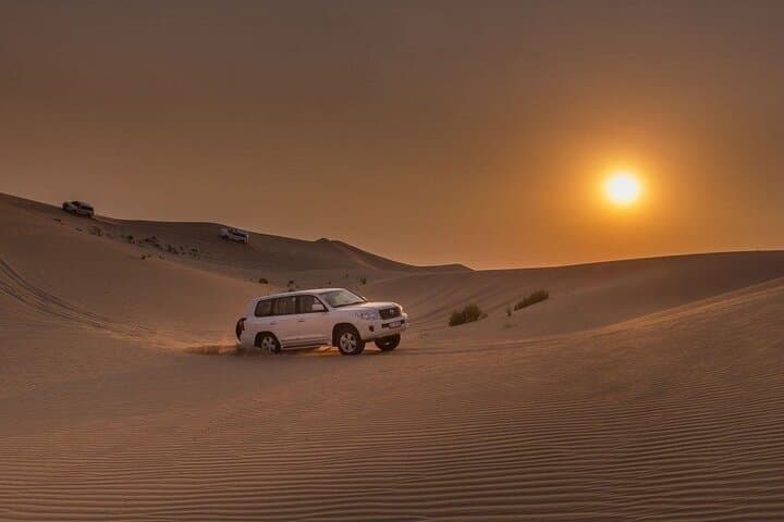 Sunrise VIP Desert Safari Dubai — Dune Bashing, Sandboarding & Camel Rides photo 2