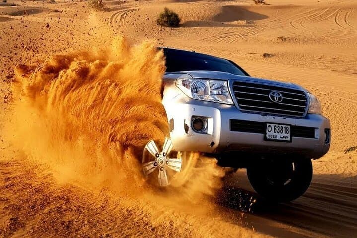 Evening Red Dunes Desert Safari in Lahbab: Dune Bashing, Sandboarding & BBQ Under the Stars