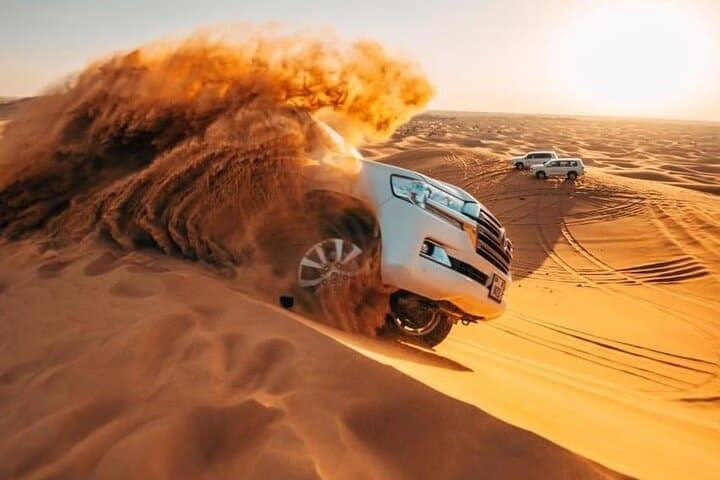 Morning Red Dunes Quad Safari in Dubai: Camel Ride & Sandboarding photo 5