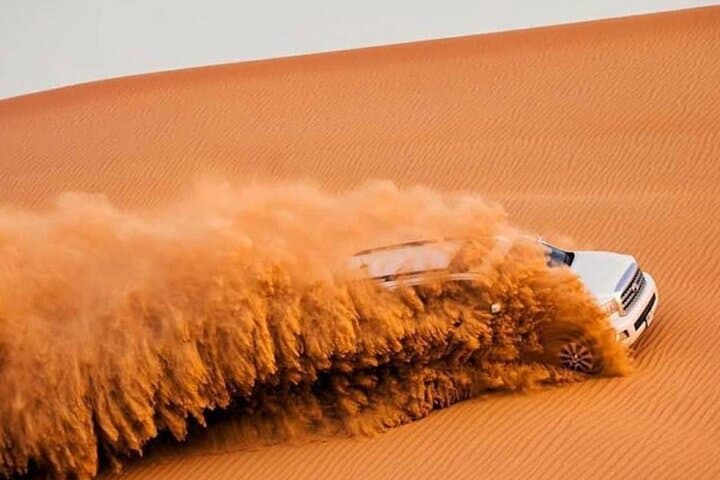 Private Dubai Desert Safari: Camel Ride, Dune Bashing, Sandboarding & BBQ Dinner photo 6