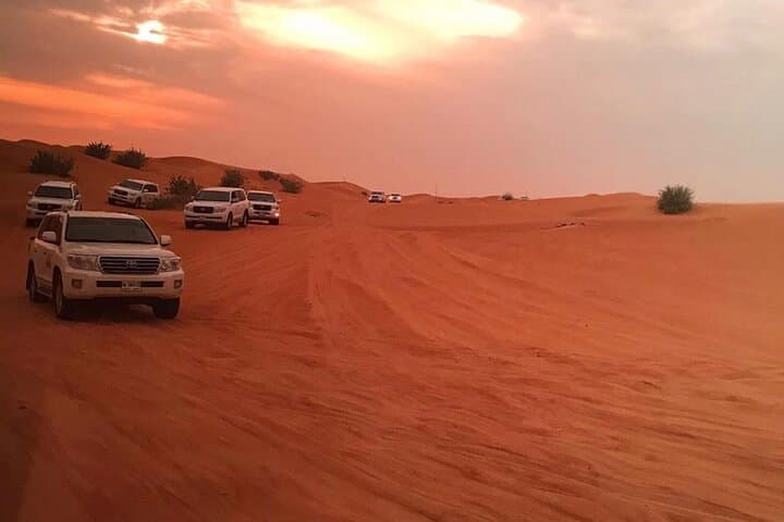 Morning Red Dunes Quad Safari in Dubai: Camel Ride & Sandboarding photo 6