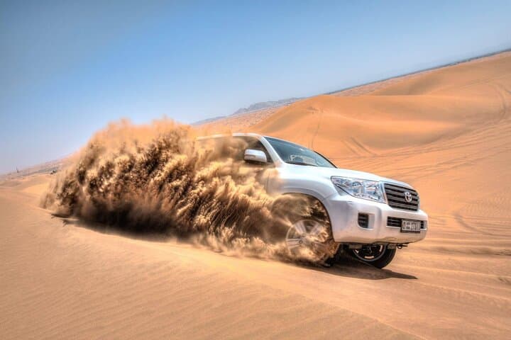 Private Dubai Desert Safari: Camel Ride, Dune Bashing, Sandboarding & BBQ Dinner photo 4