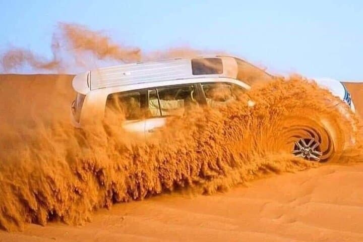 Dubai Desert Safari with Premium BBQ Dinner: Dune Bashing, Camel Rides & Live Shows photo 2