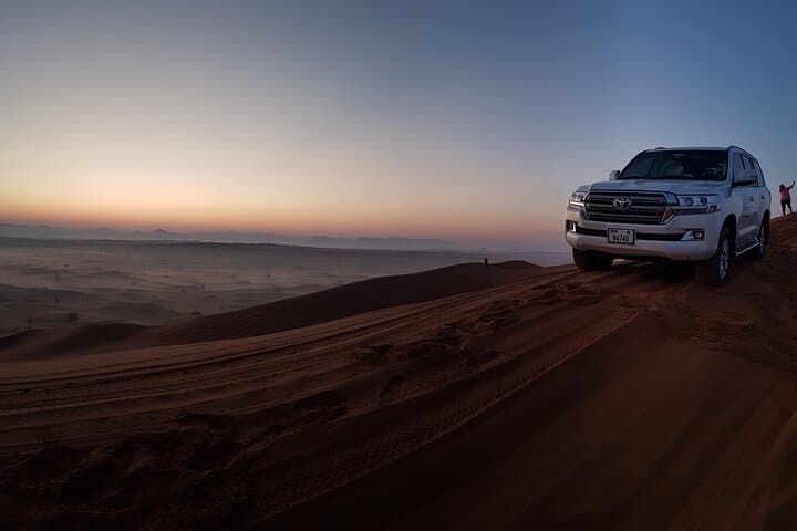 Dubai Sunrise Red Dunes Safari: Private Morning Dune Bashing, Sandboarding & Camel Ride photo 1