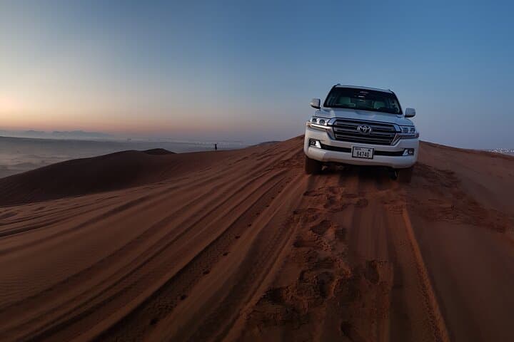 Dubai Sunrise Red Dunes Safari: Private Morning Dune Bashing, Sandboarding & Camel Ride photo 2