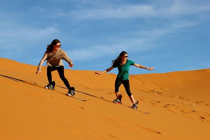 Dubai Sunset Camel Caravan: Sandboarding, Henna & BBQ Desert Experience photo 3