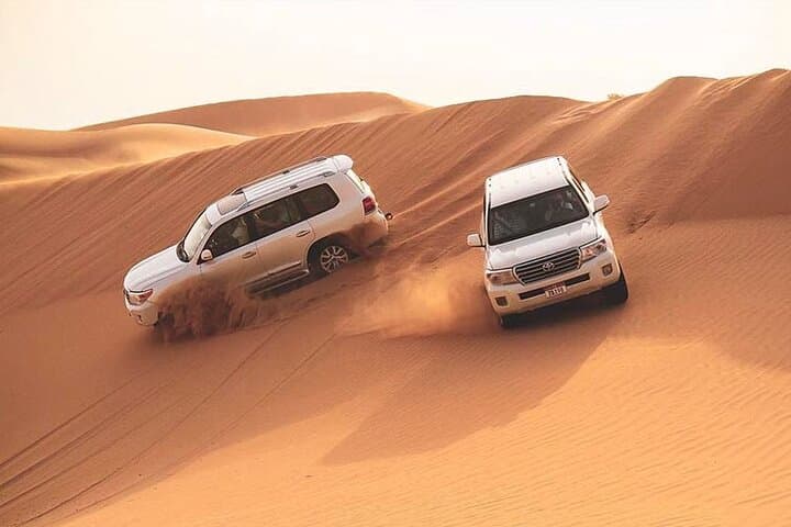 Red Dunes Dubai Desert Safari: Dune Bashing, Sandboarding & Sunset BBQ